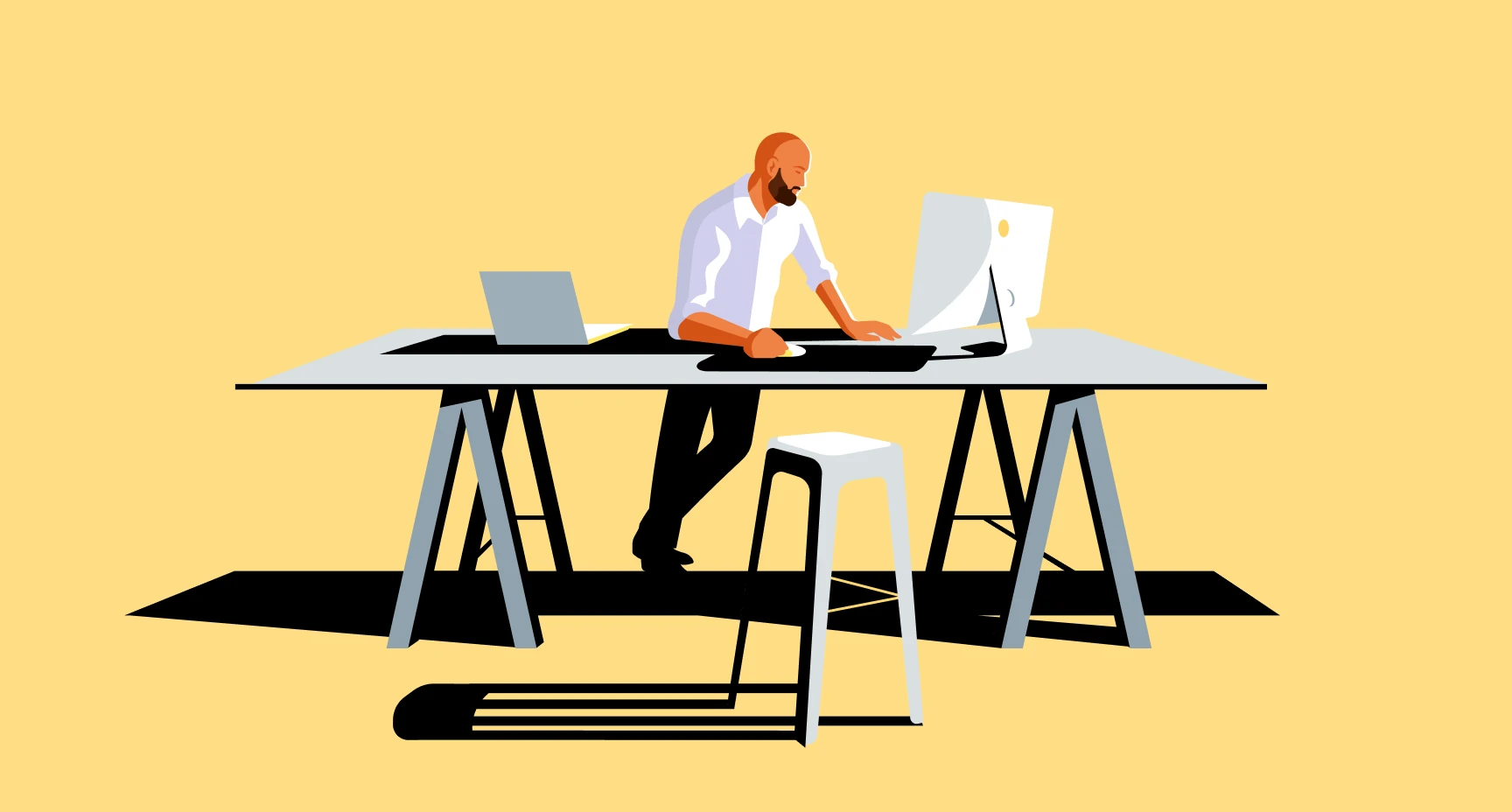 Flat vector illustration of Max Manzini standing at a trestle desk, working at an iMac with a laptop beside him and a stool casting a long hard shadow.